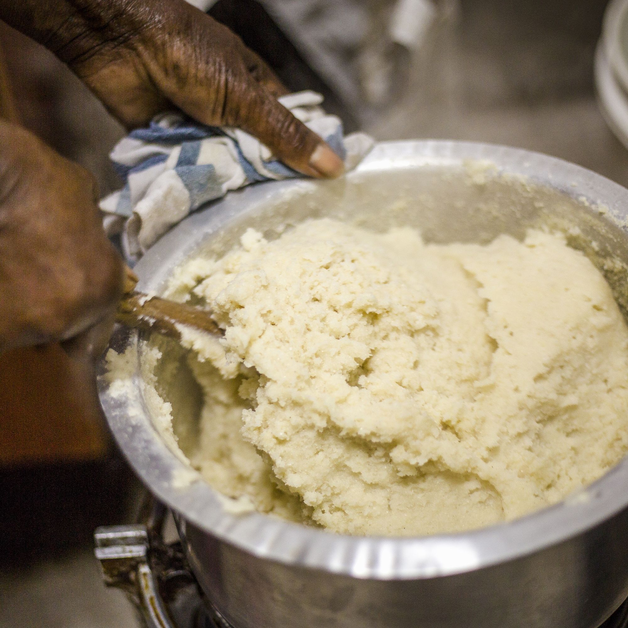 Woman preparing maize flour