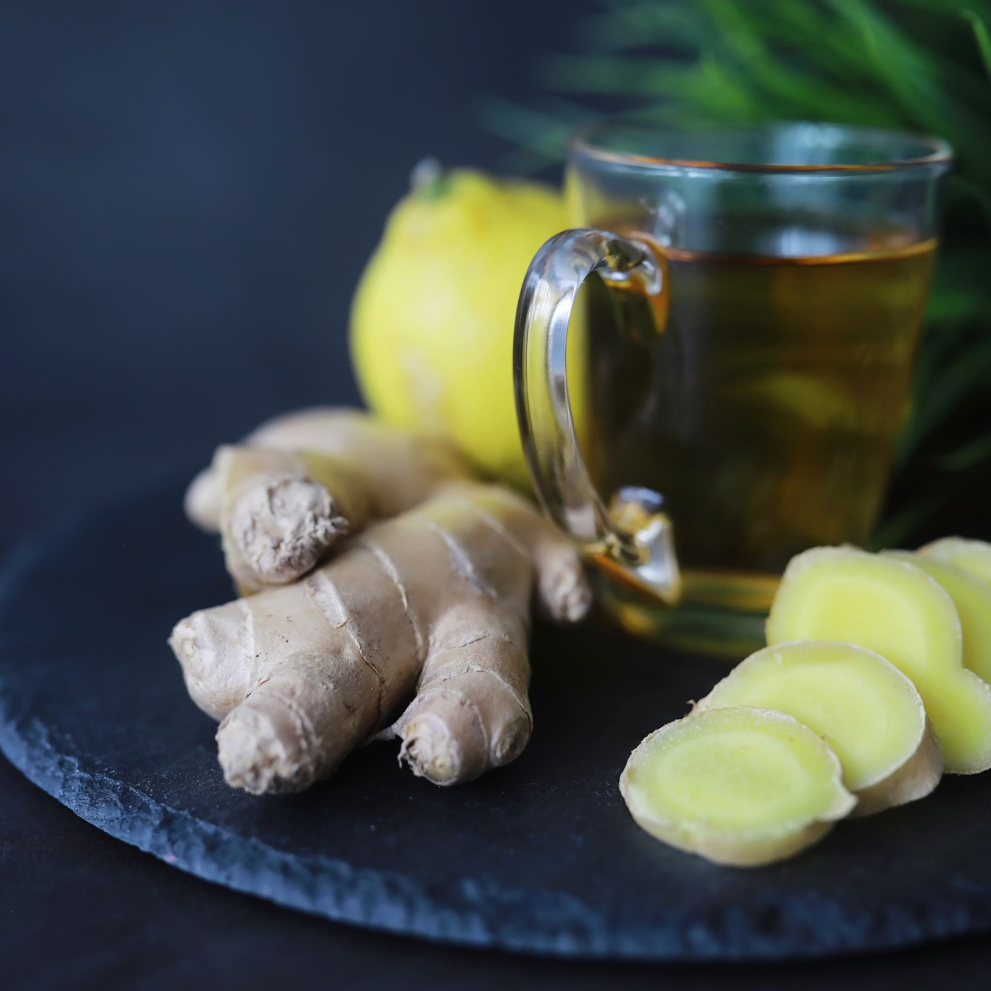 Ginger root whole and sliced. Ginger tea with lemon