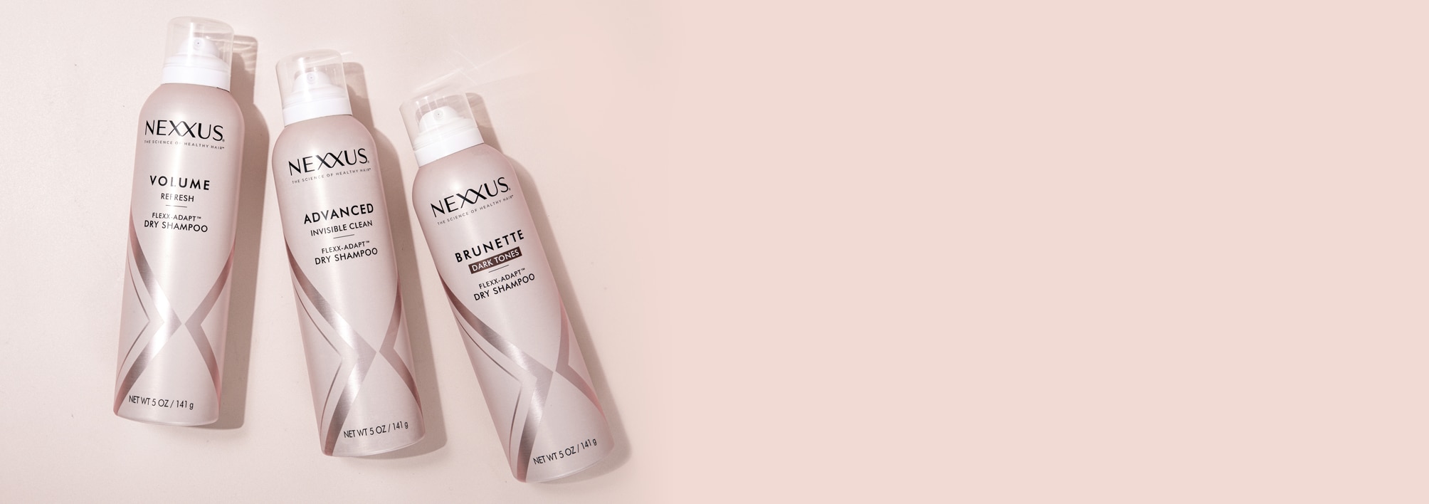 Three bottles of new Nexxus Flexx Adapt dry shampoo spray, the best dry shampoo for colored hair, the best dry shampoo for oily thin hair and the best dry shampoo for curly hair.
