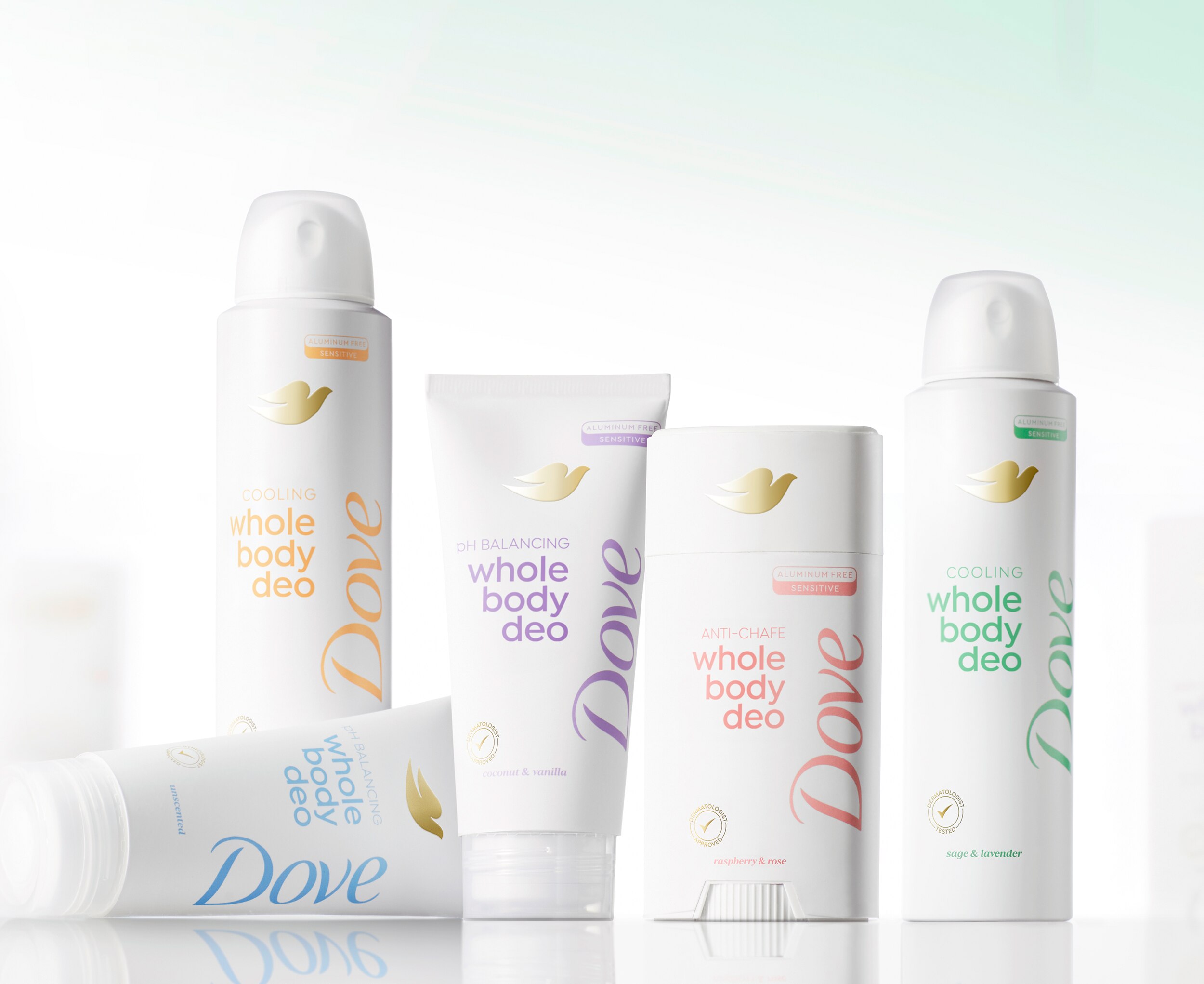 Packs of the Dove whole body spray, cream and stick deos standing against a light green background 