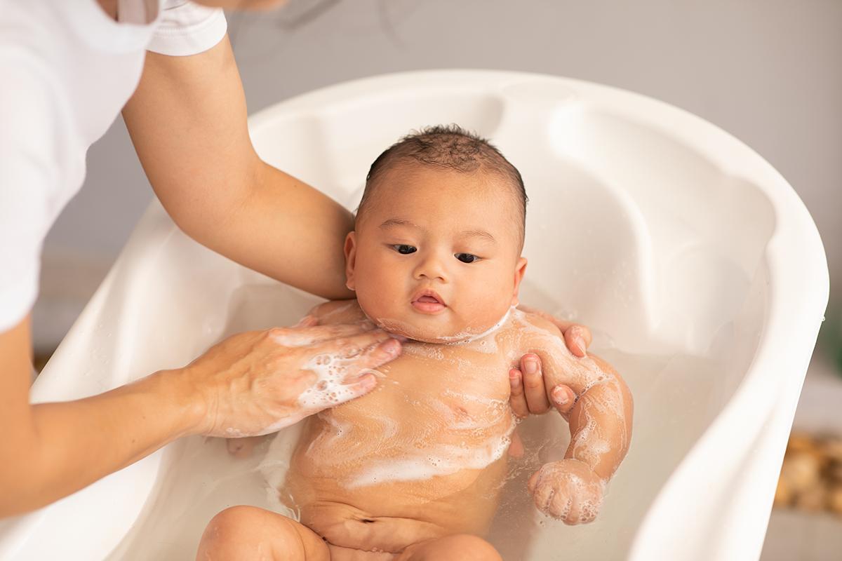 Asian baby in bath