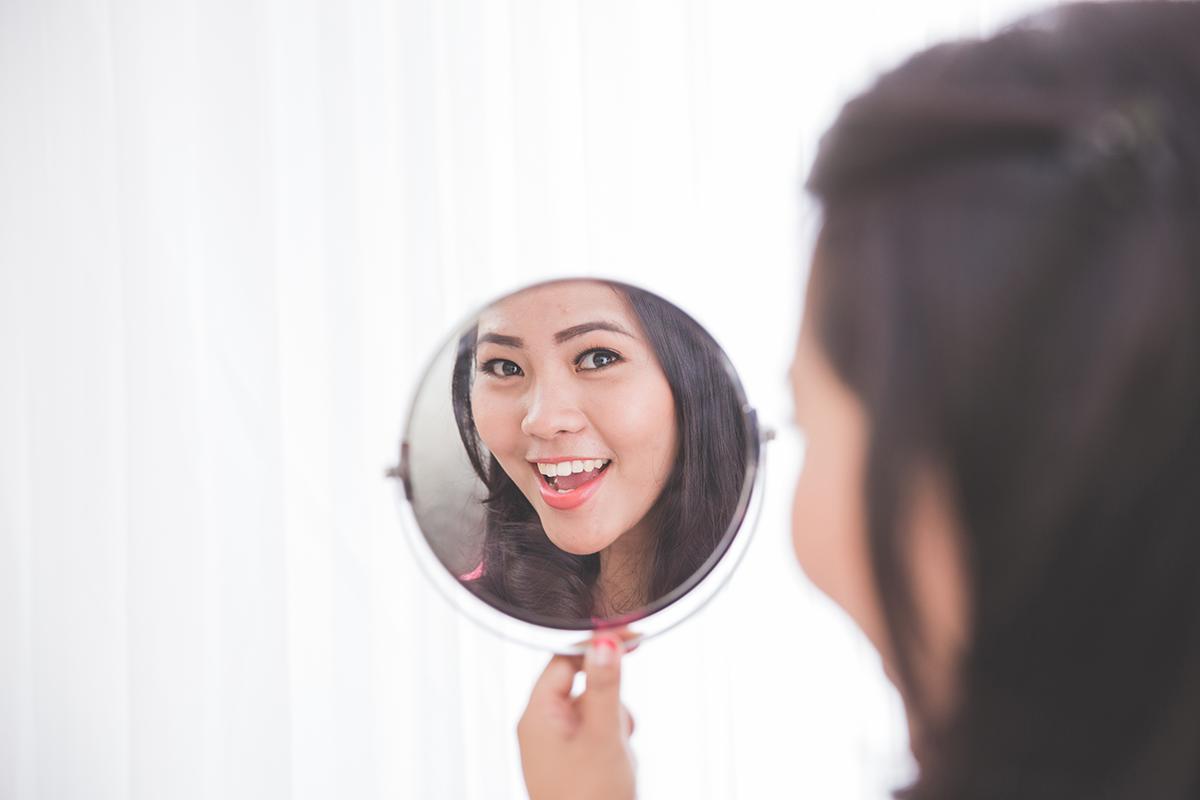 Woman looking in the mirror