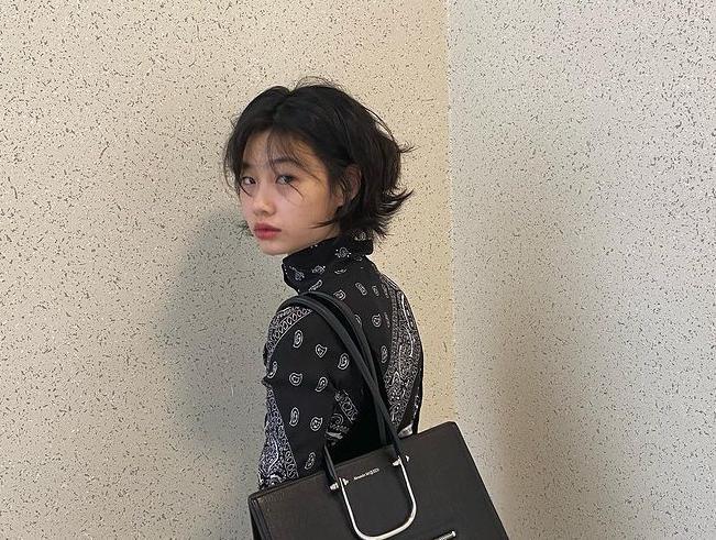 Asian woman with a short wolf cut