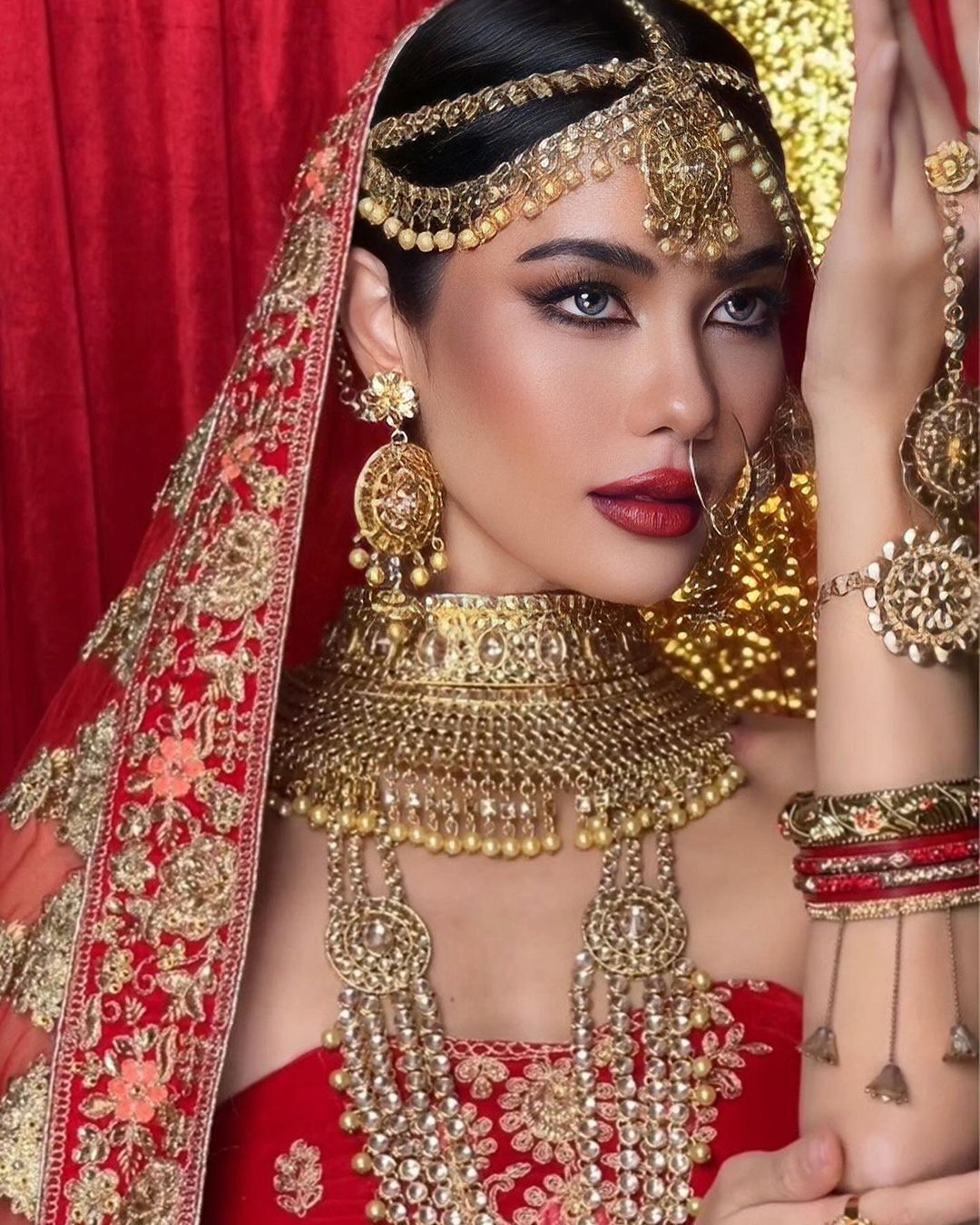 Woman posing with Indian-style wedding attire.