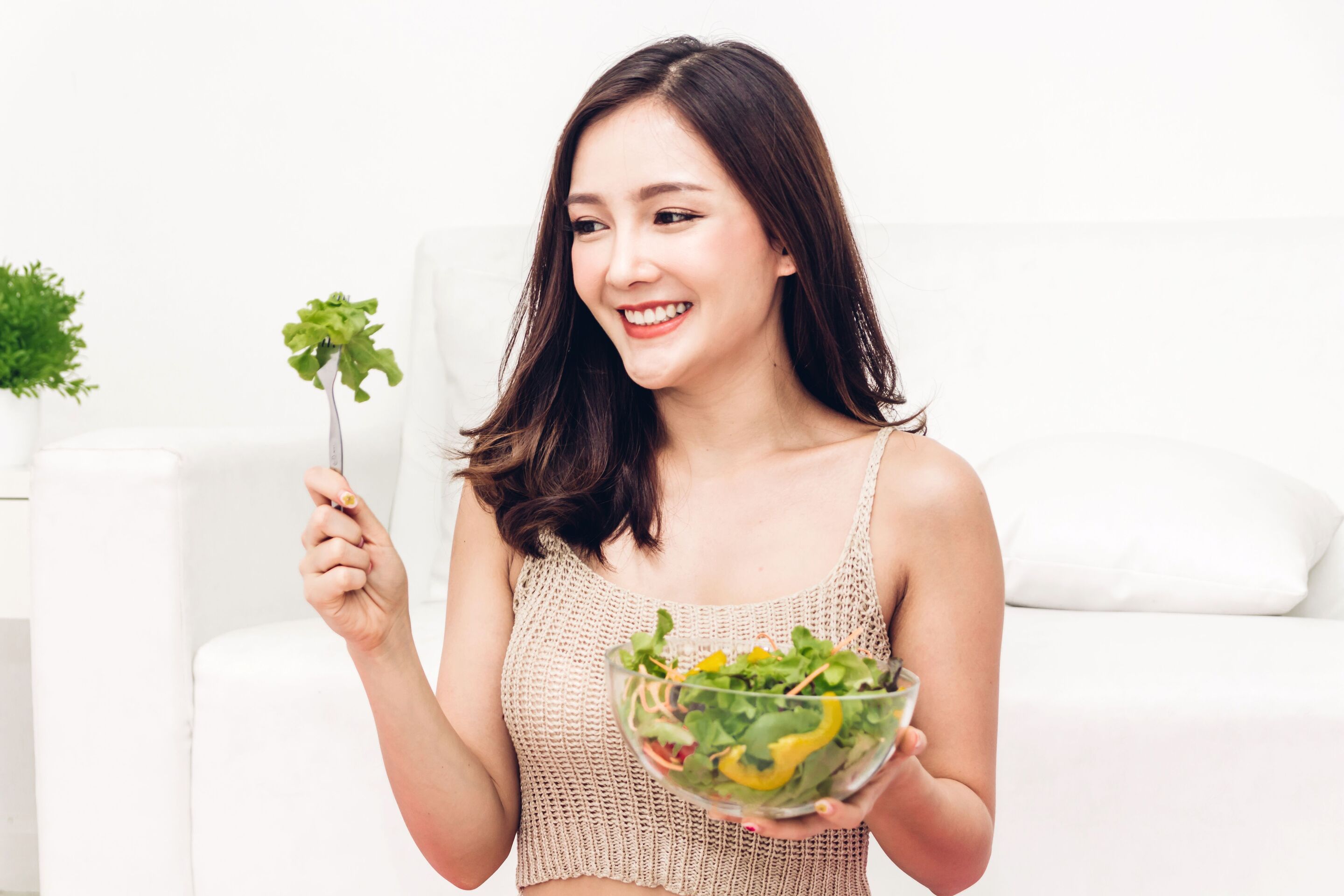 woman eating salad