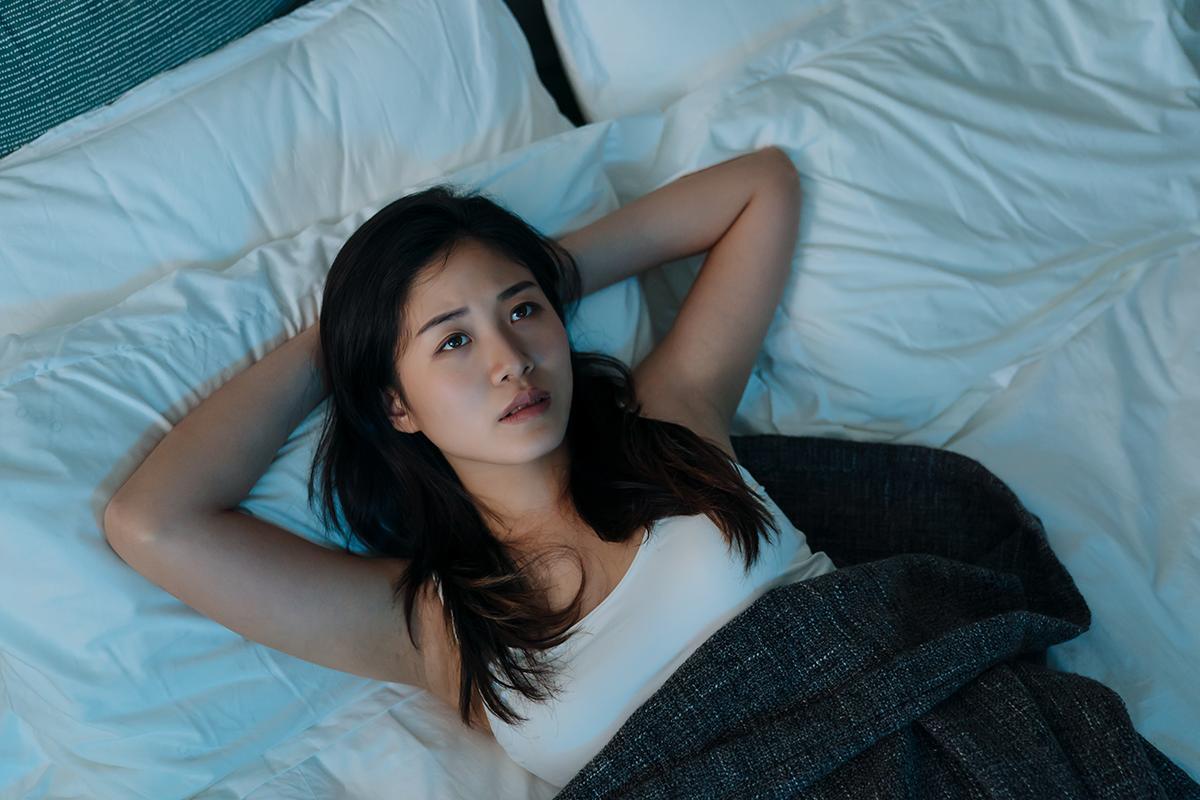 Asian woman worried and suffering from lack of sleep
