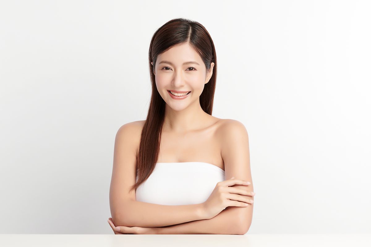 Asian woman with beautiful hair smiling happily 