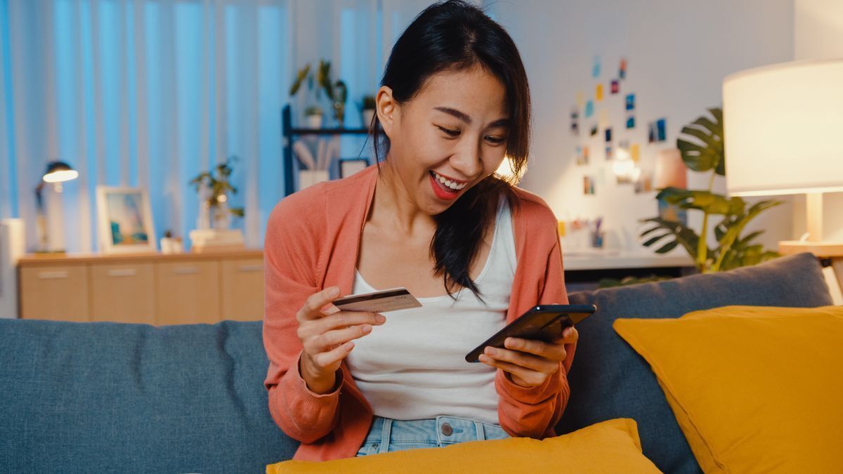 Asian woman happily online shopping