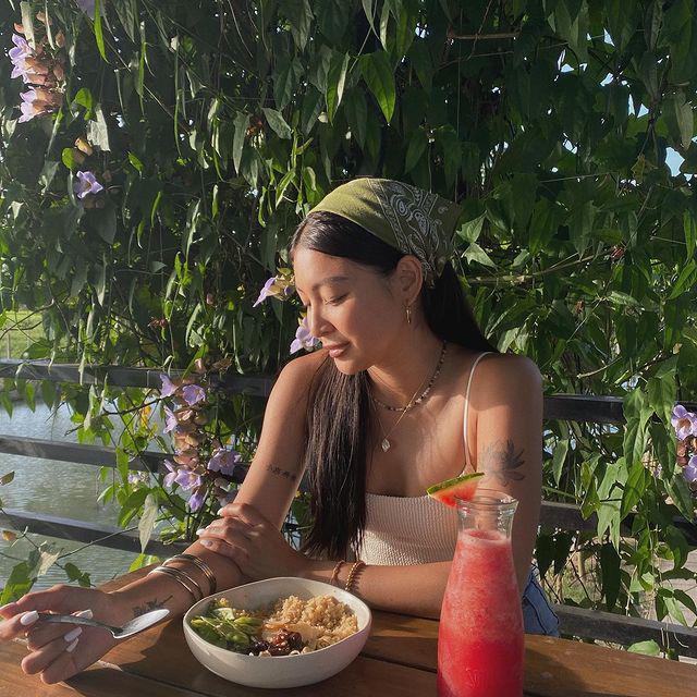 Nadine Lustre wearing a bandana while eating