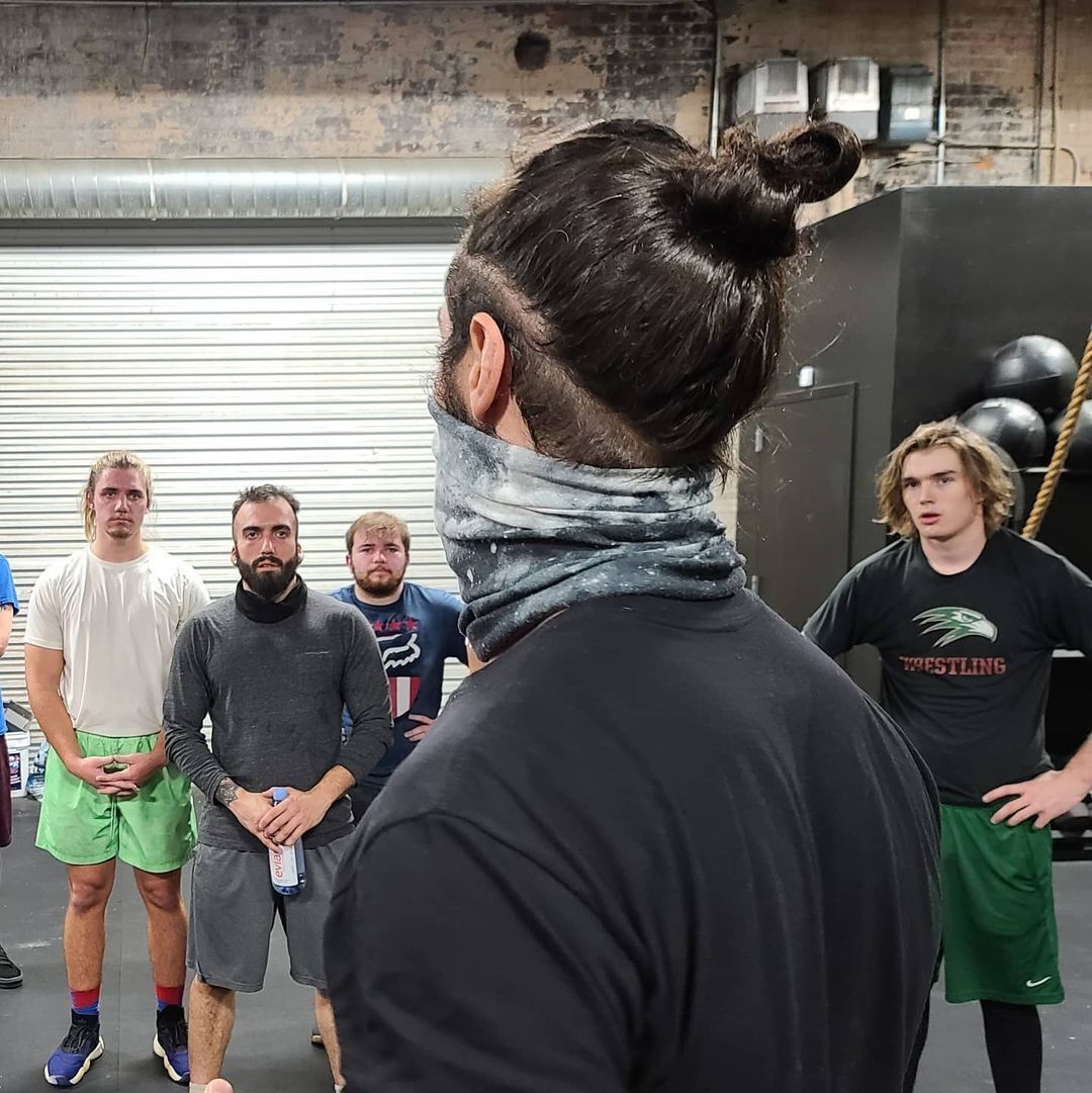  Wear your locks in a sleek man bun. (Credit: instagram/blackandbravewrestling) 