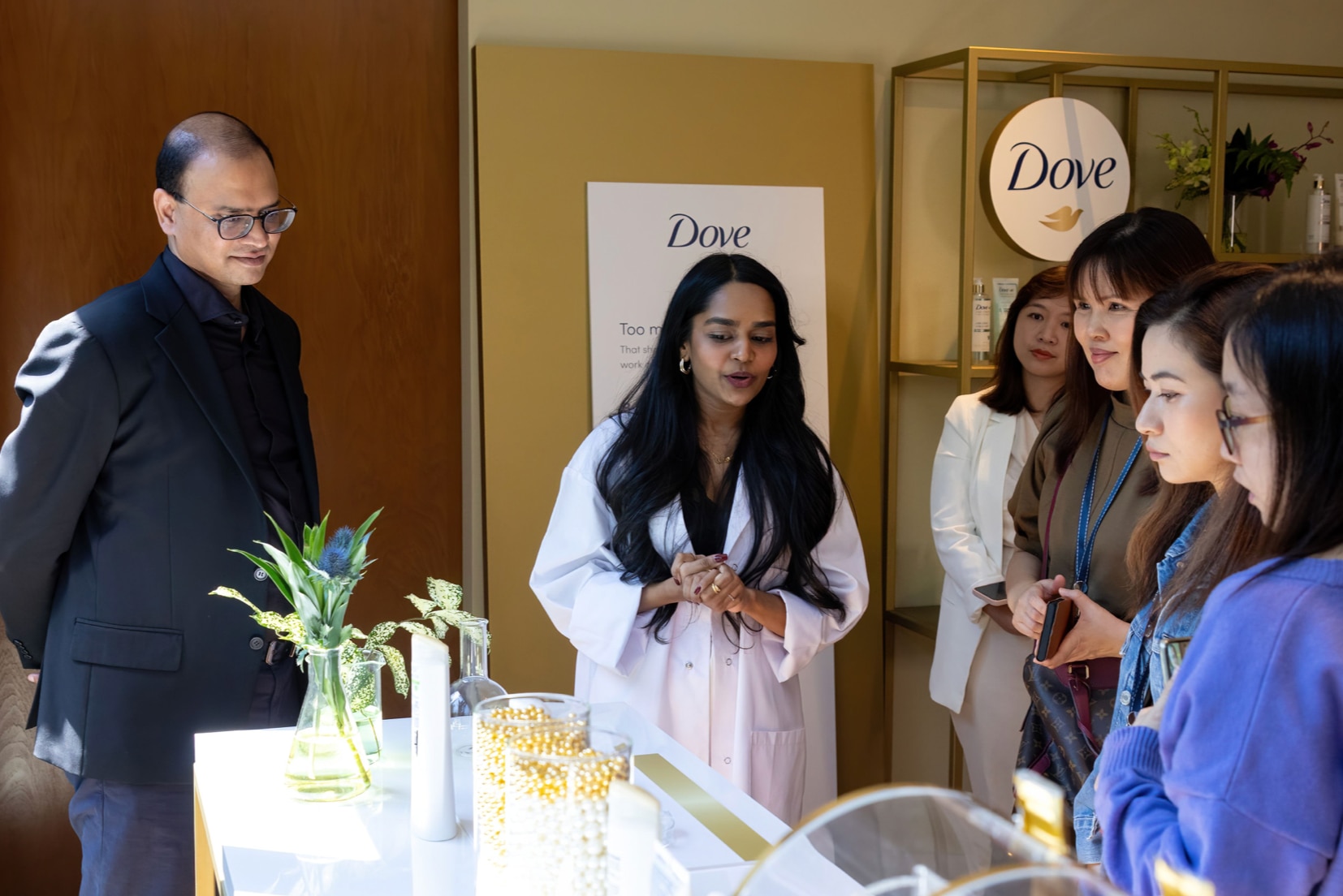 People listening to a doctor speak at an event.