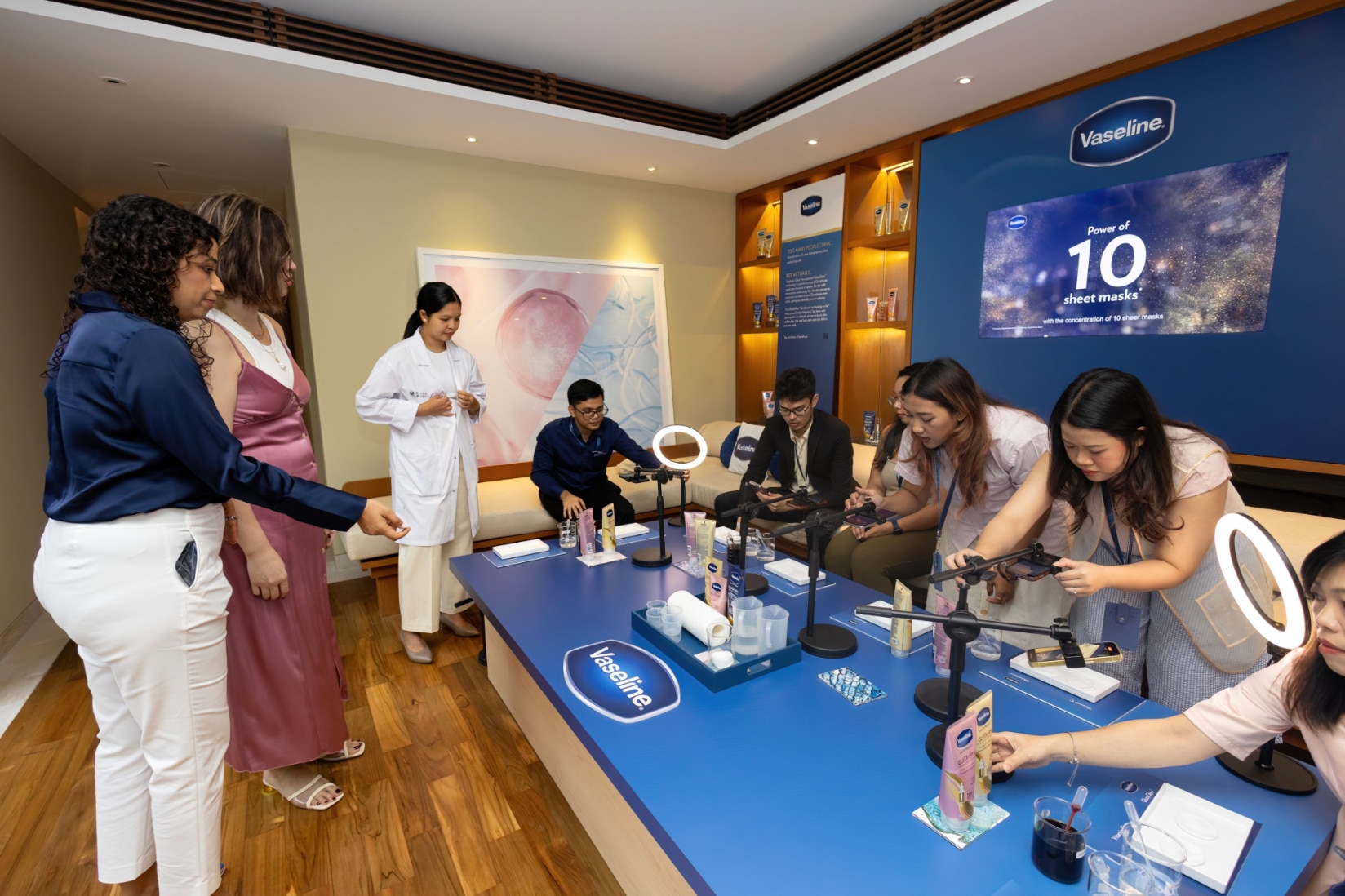 People taking pictures of products at an event. 