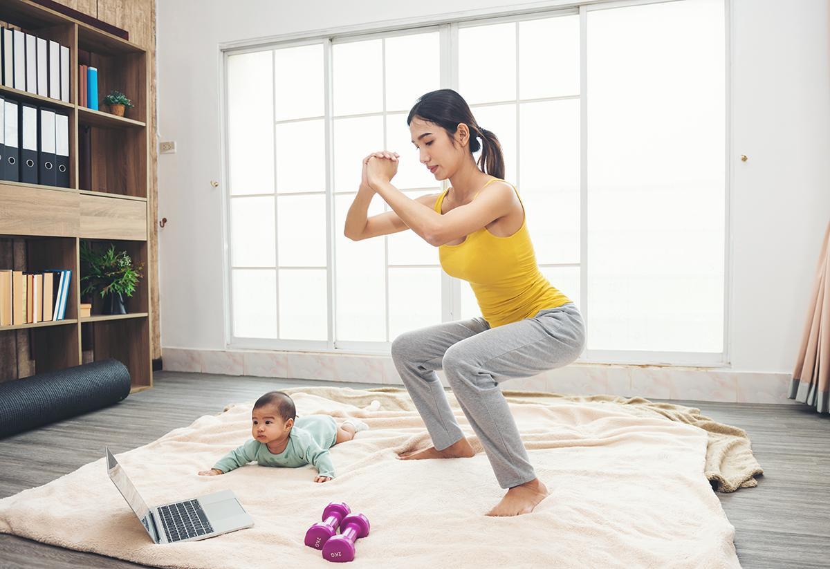 Asian mom exercising with baby