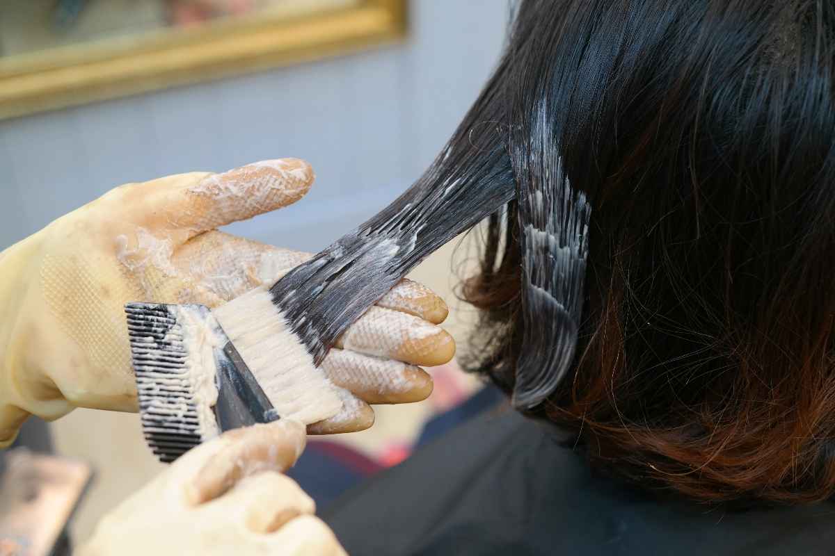Woman getting her hair dyed at a salon.