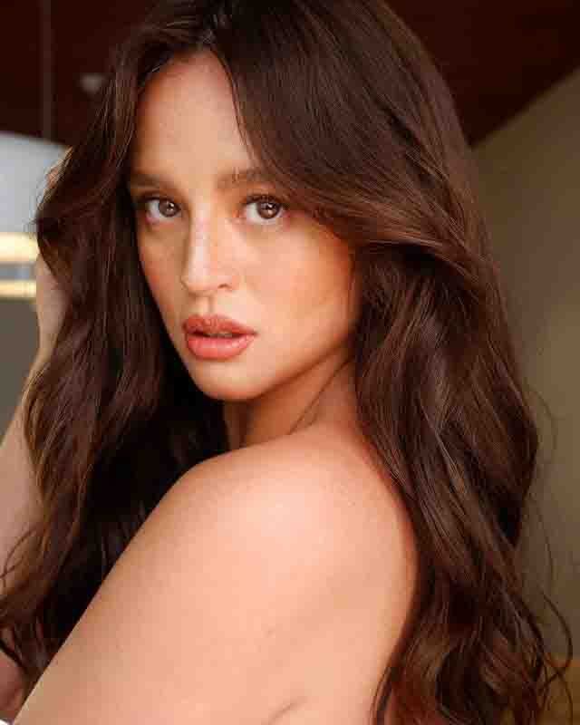 Georgina Wilson portrait with long wavy hair