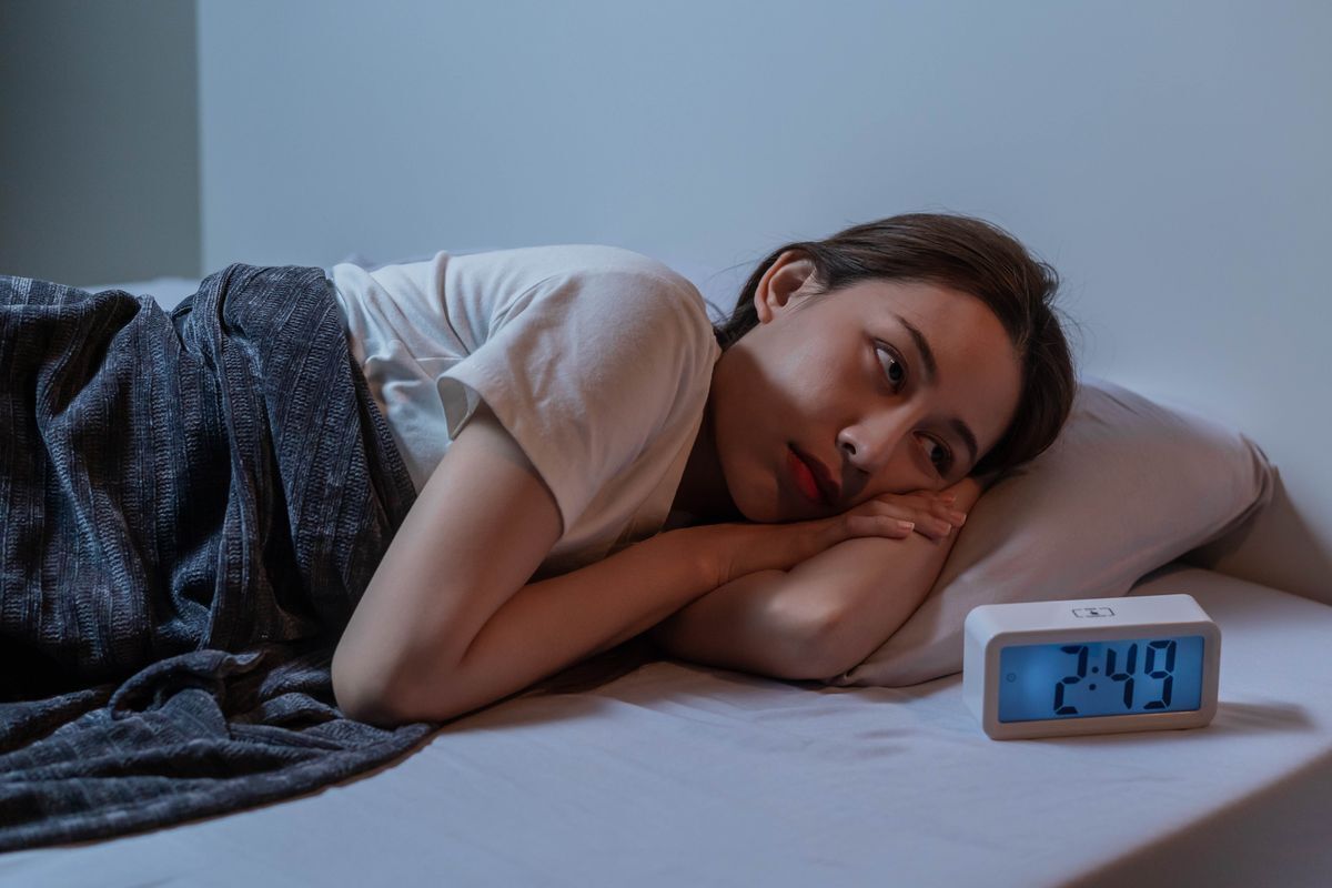 Asian woman unable to sleep