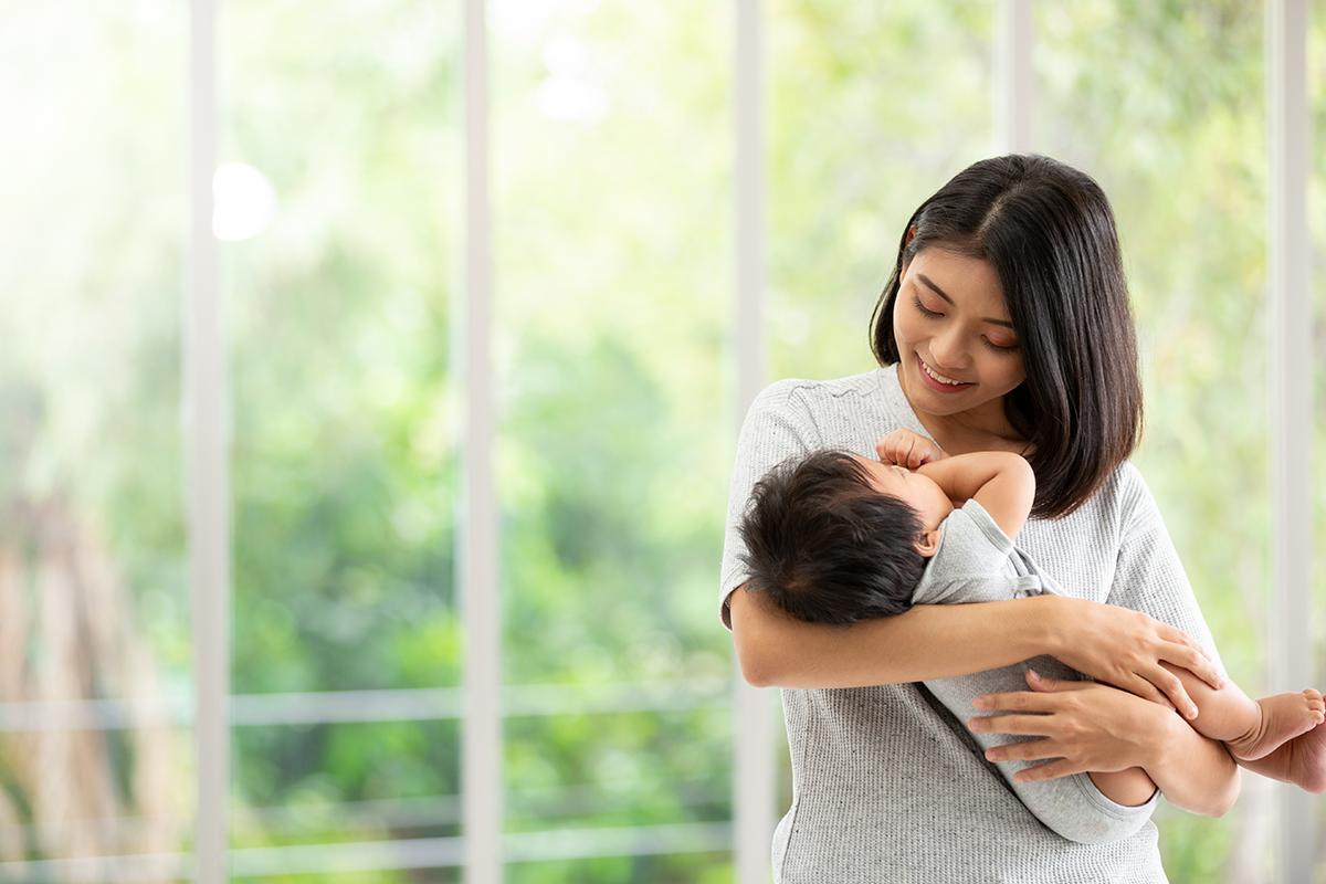 Mom carrying her baby