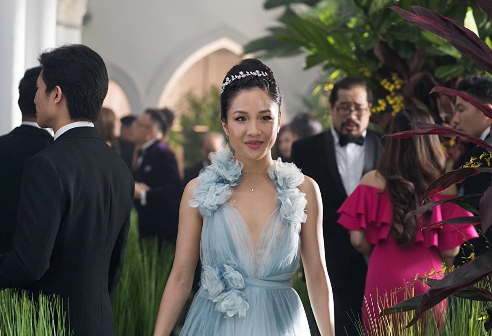 Constance Wu in a blue gown at a party