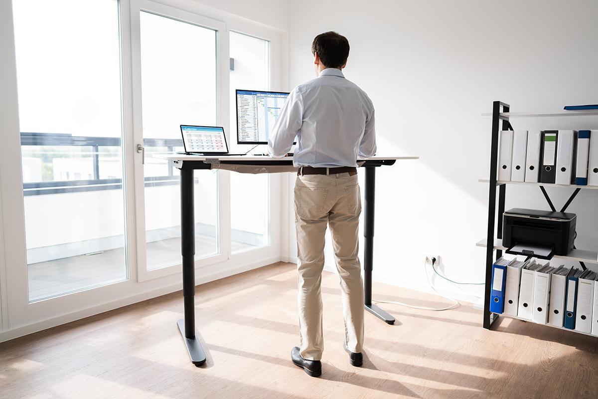 Man working on standing desk