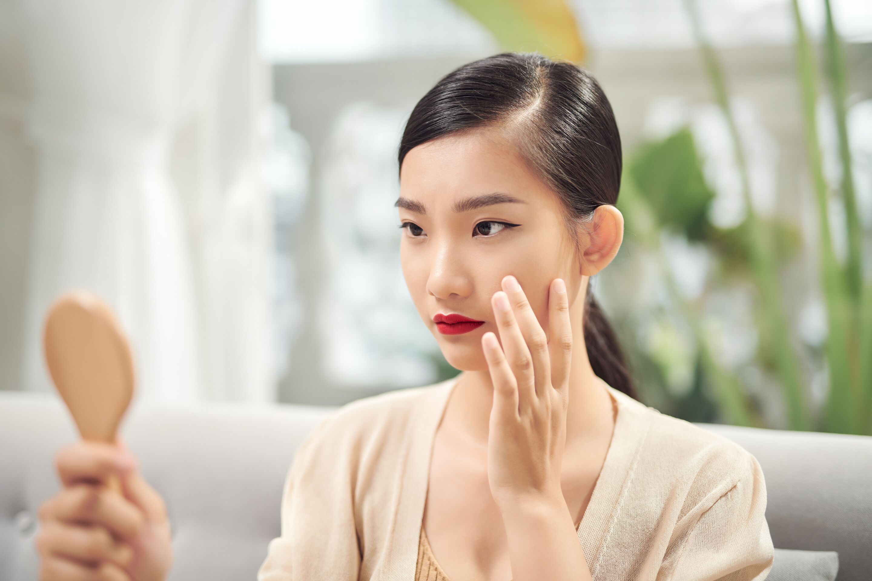 Woman with a hand mirror.