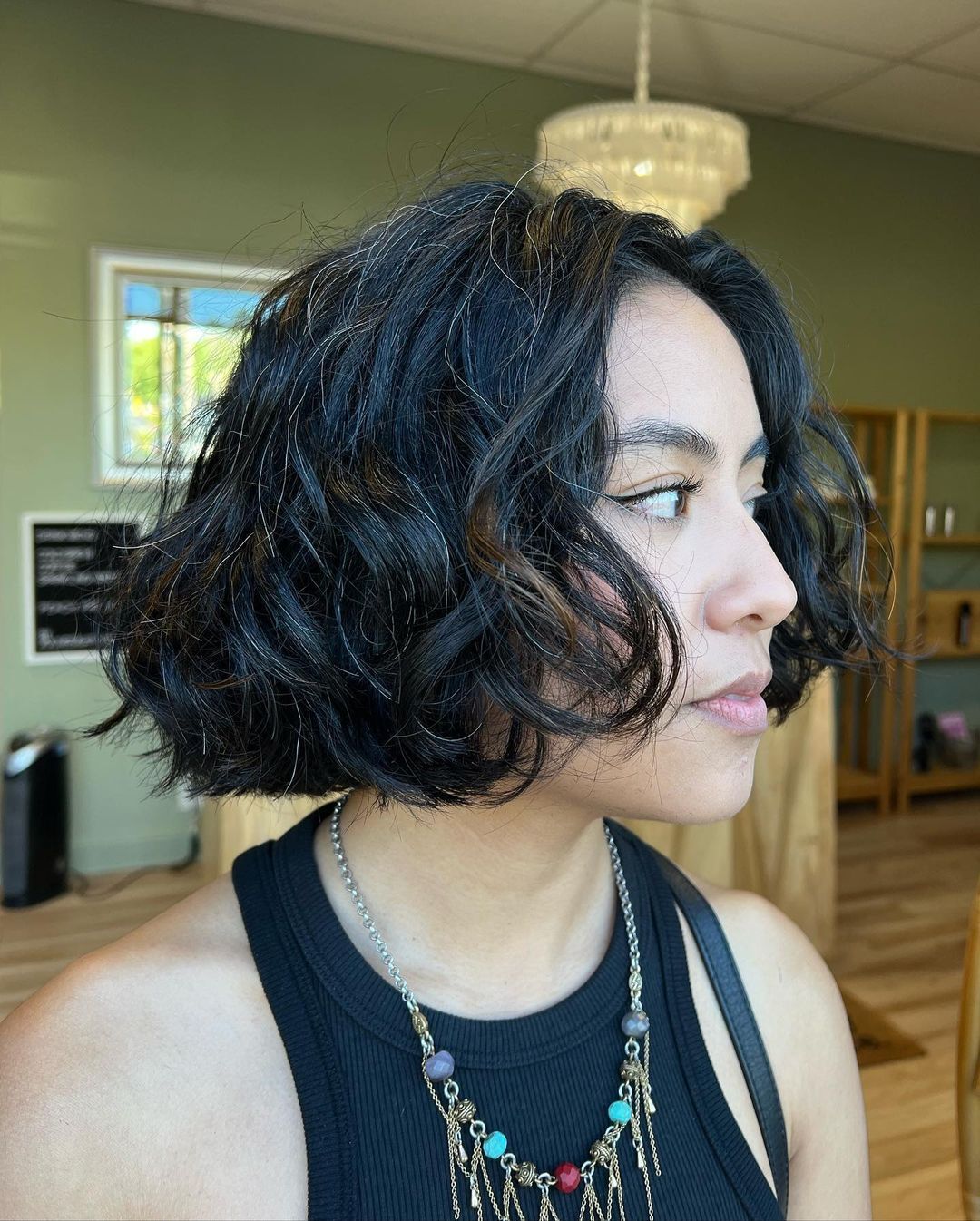 Woman with curly French bob.