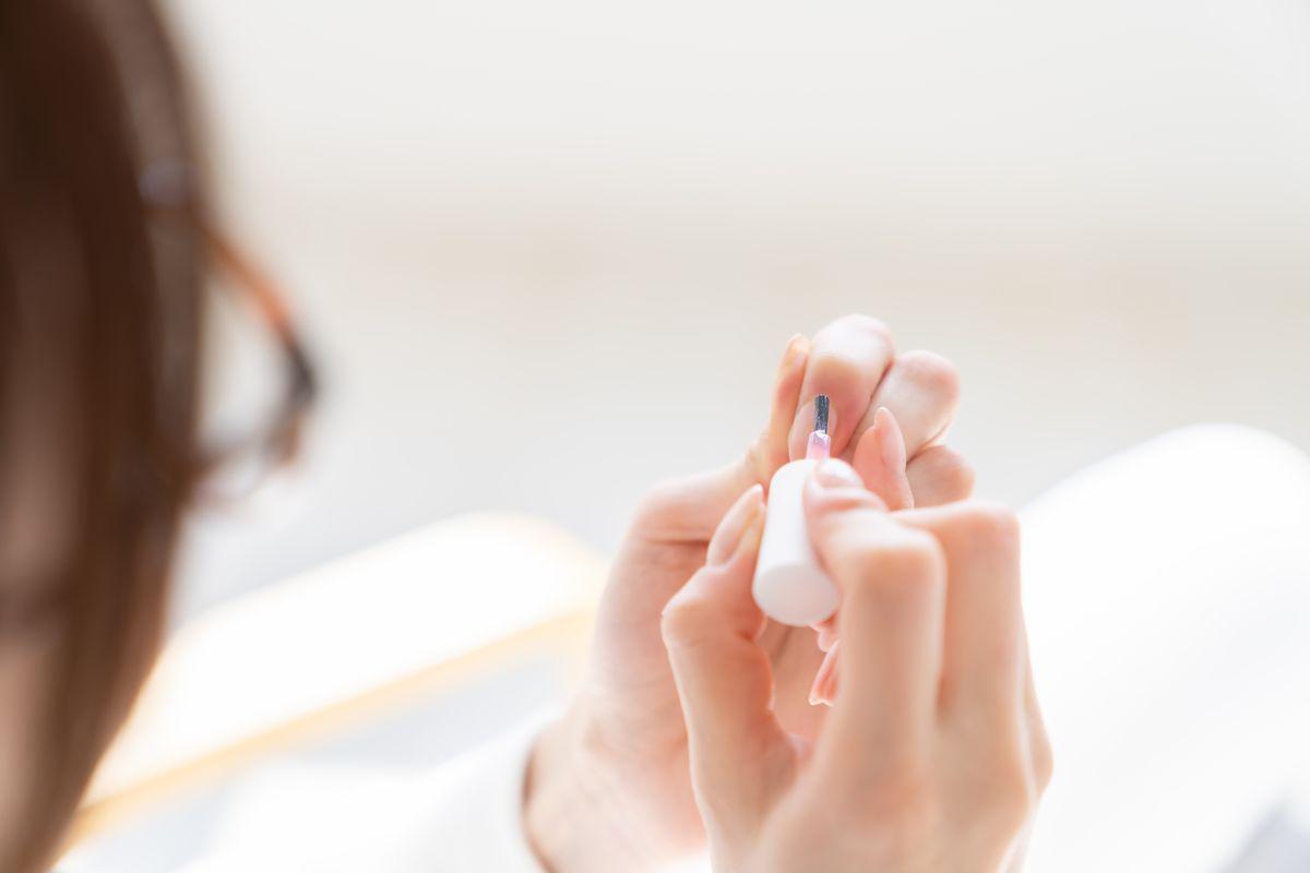 Woman doing her own manicure 