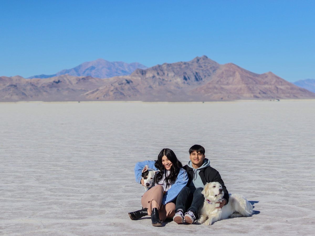 Filipino woman and Filipino man with two large dogs. 