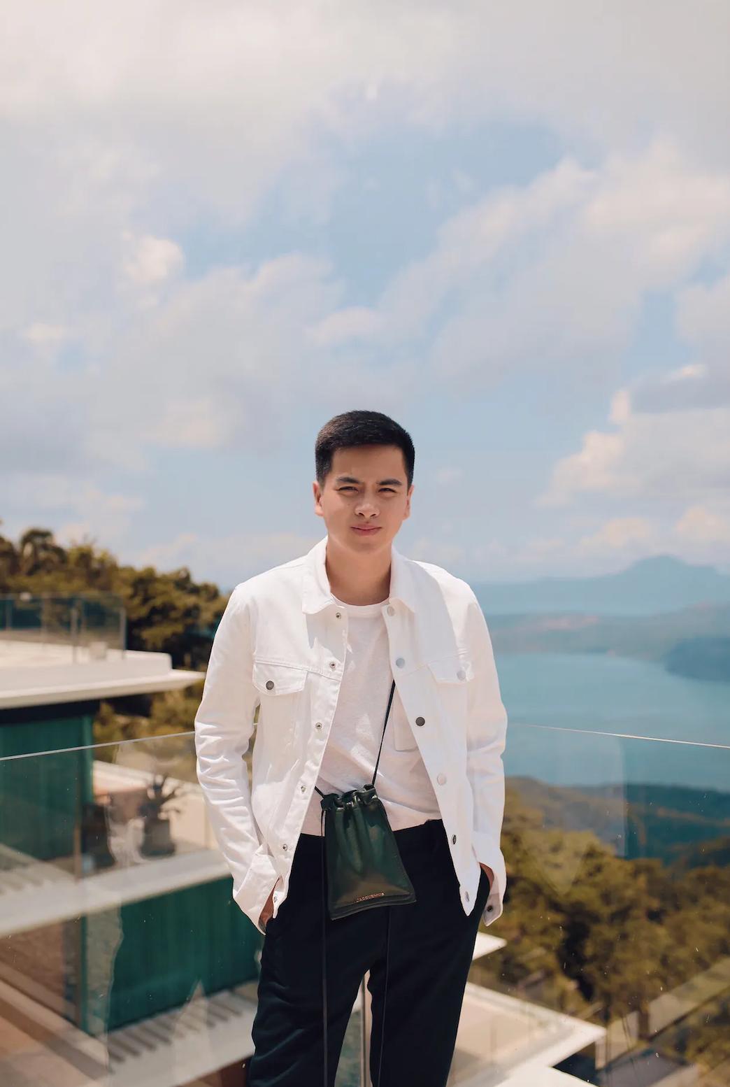 Asian man in white top and jacket