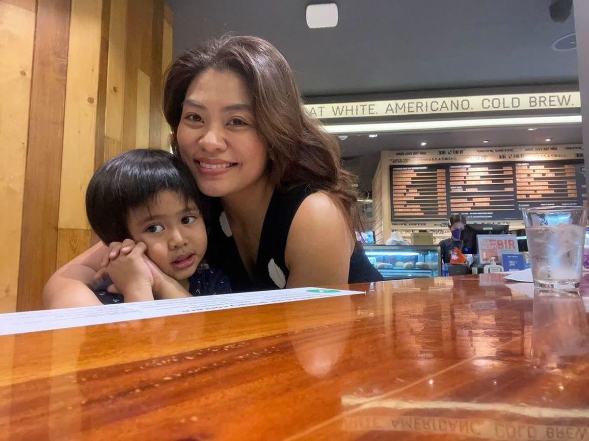 Asian mom with son at restaurant