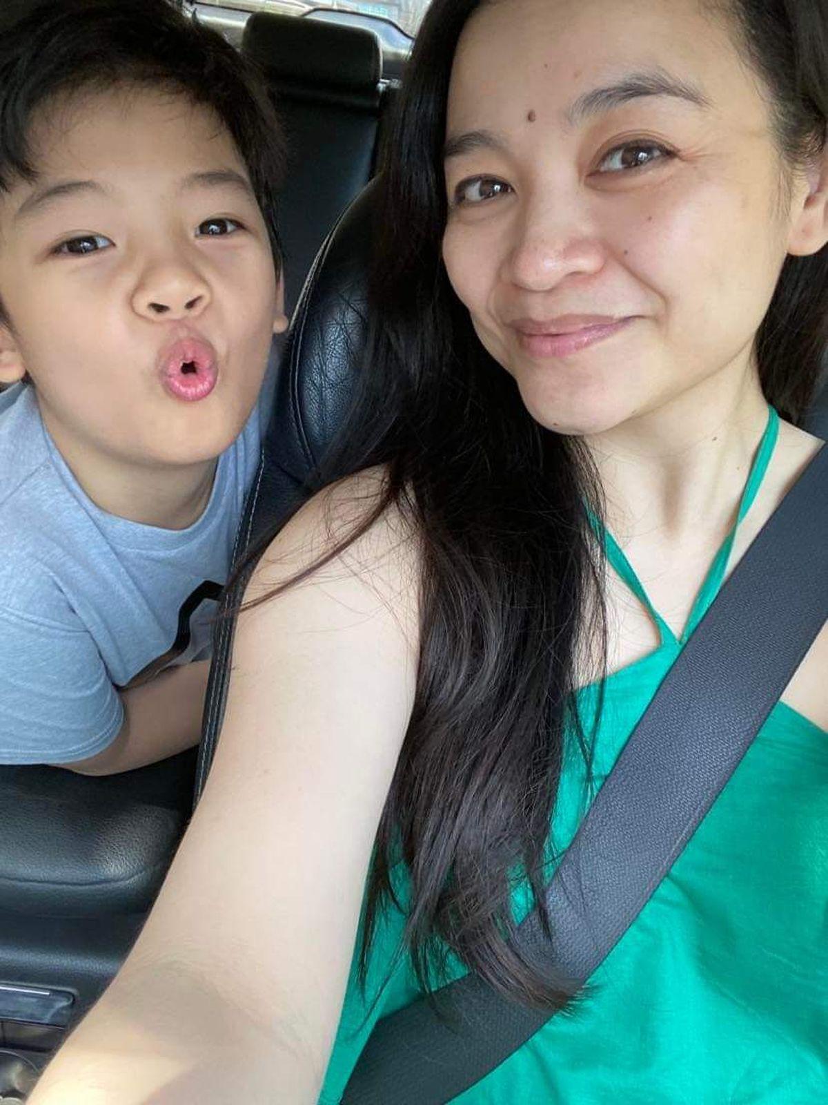 Asian mom with son in car 