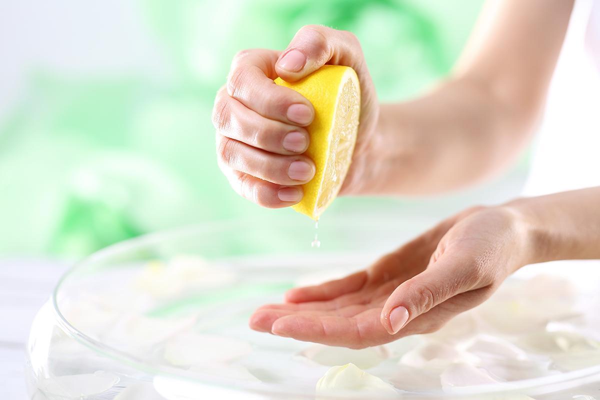 Woman squeezing lemon juice