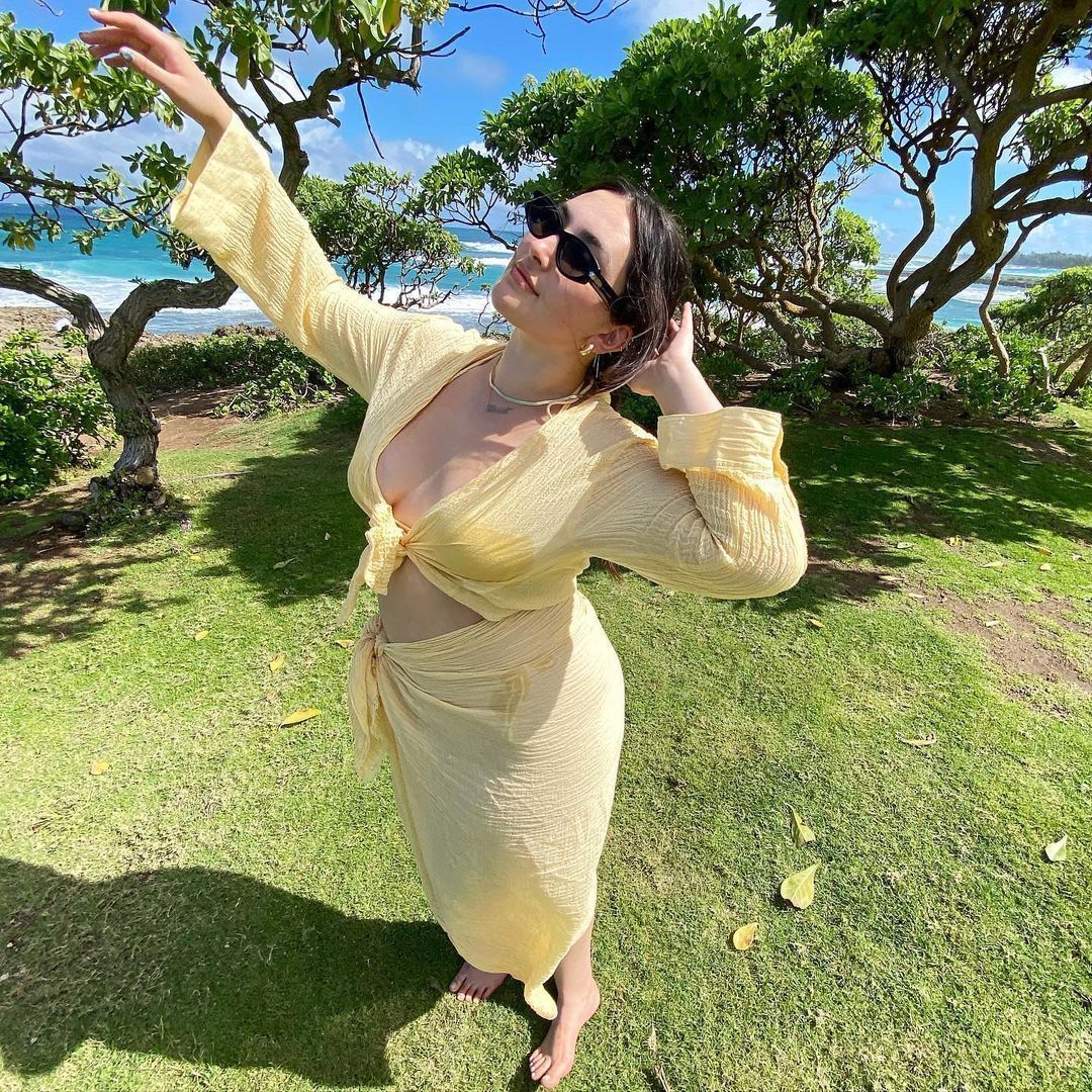 A portrait of woman wearing a yellow co-ord set.