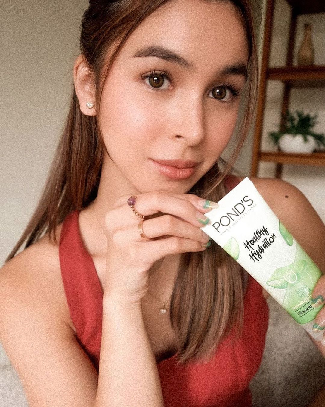 Julia Barretto holding POND's moisturizer