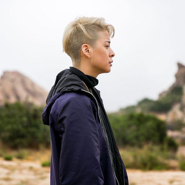 Asian woman with blonde undercut hair