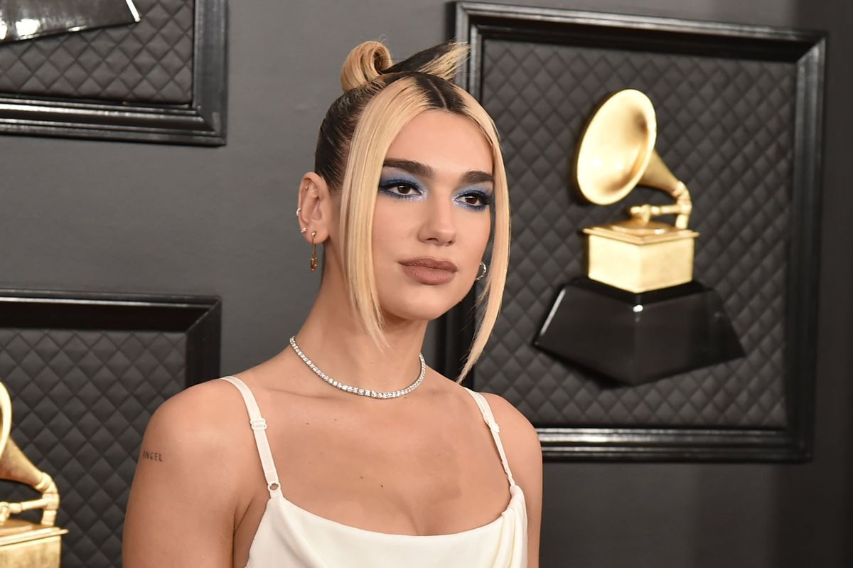 Dua Lipa with blonde hair around face at the Grammys