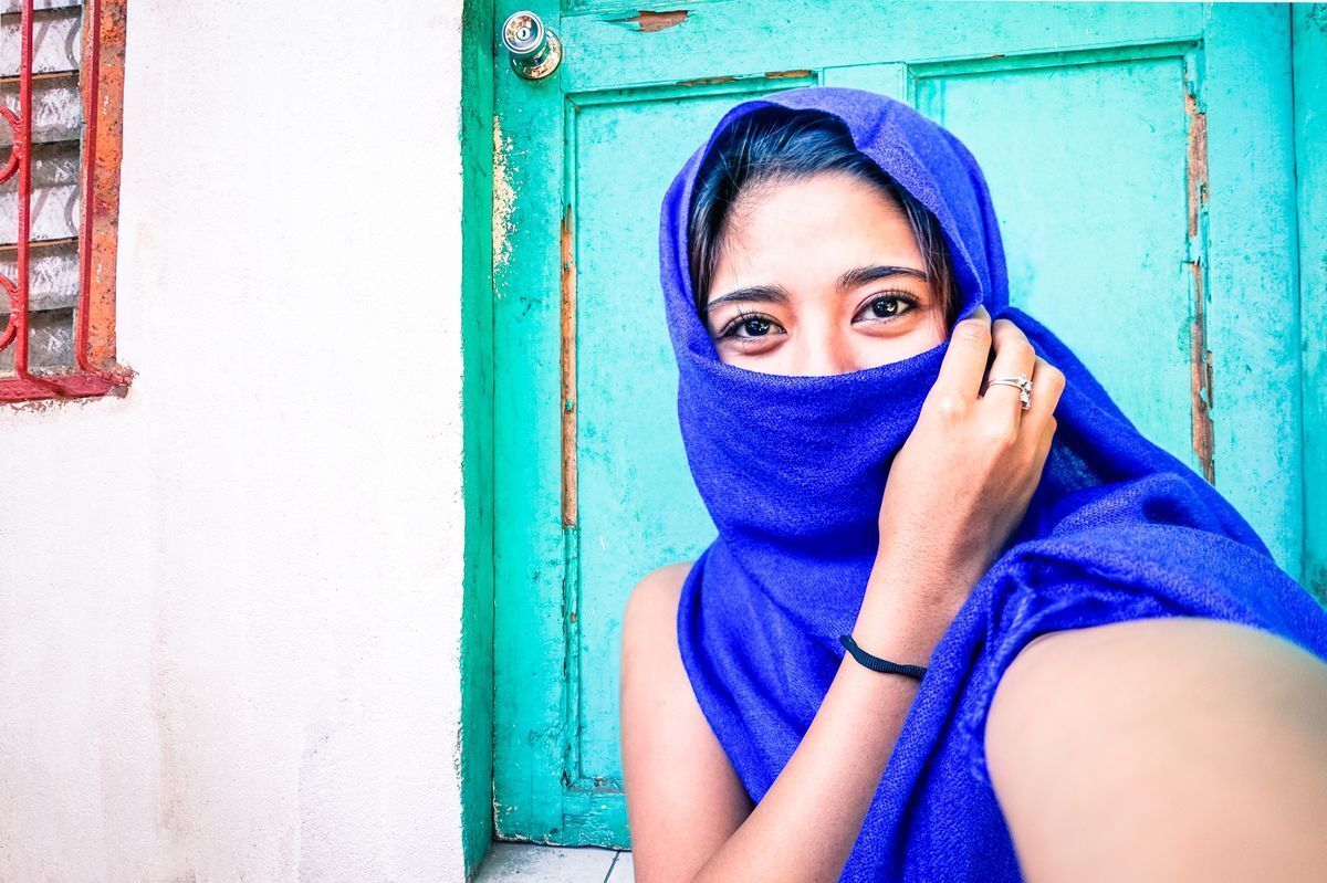 Filipino woman wearing a blue scarf