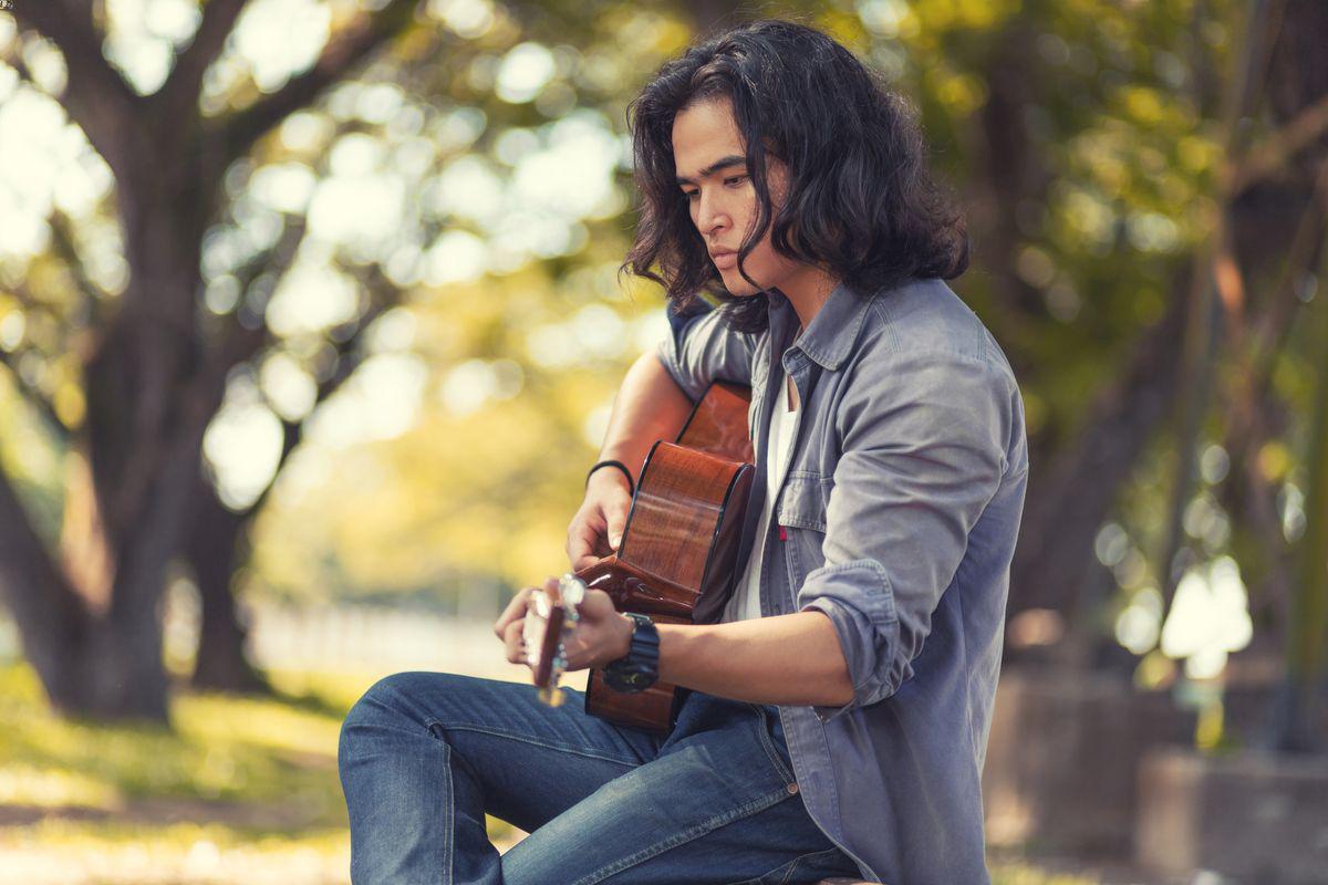 Asian man with guitar