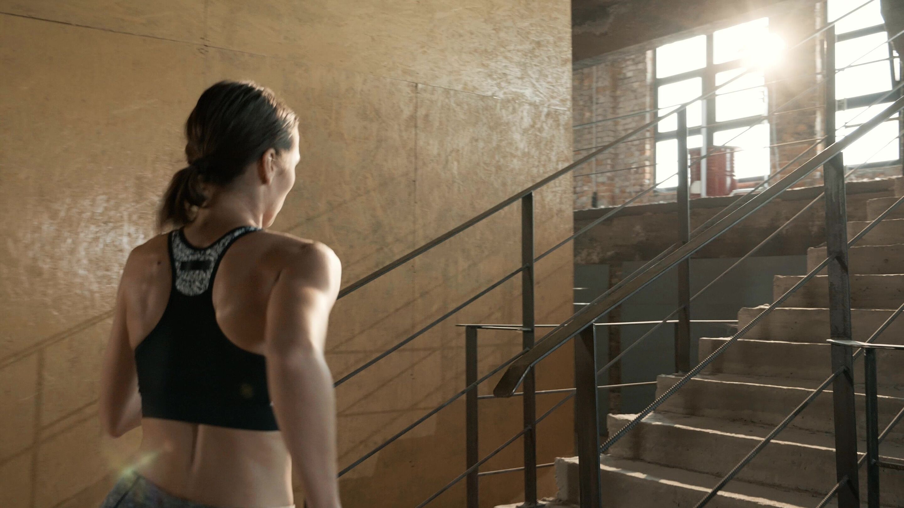 woman running up the stairs