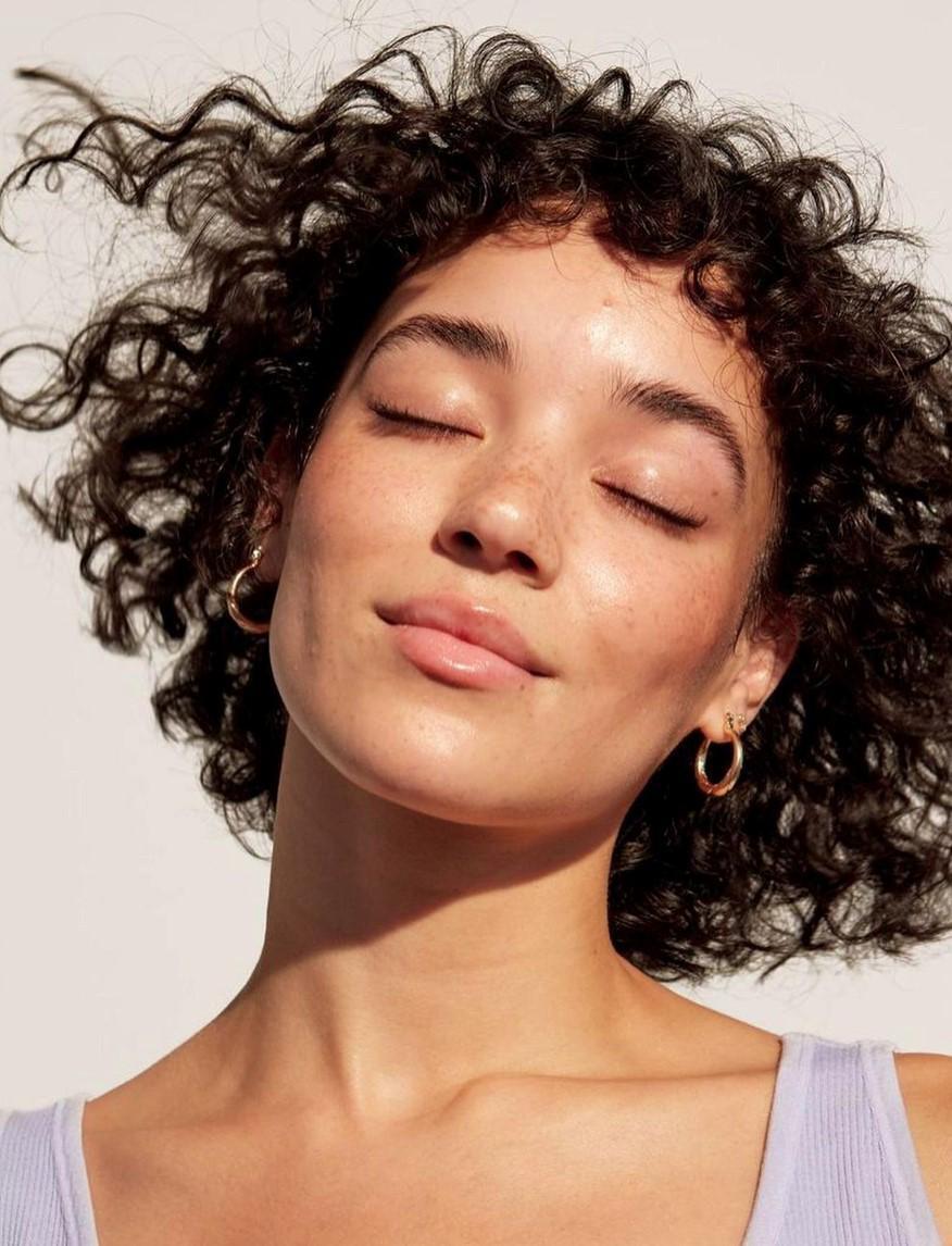 Woman with short curly hair