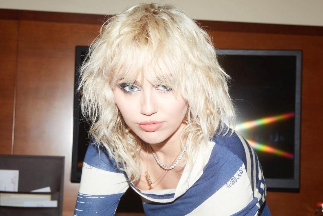 Miley Cyrus with blonde shaggy hair