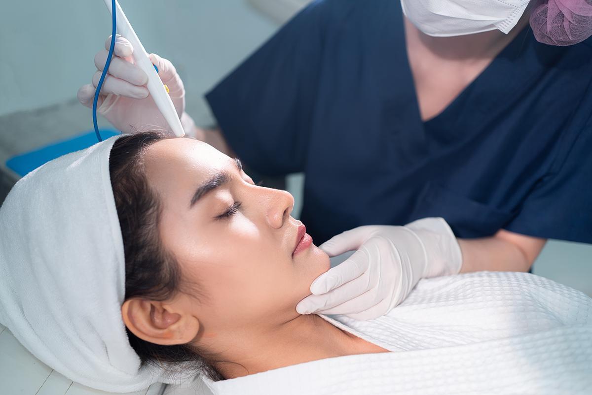 Woman undergoing a microdermabrasion procedure