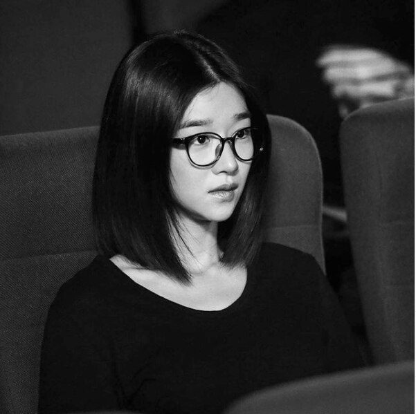 Seo Yea ji wearing black glasses in black and white photograph