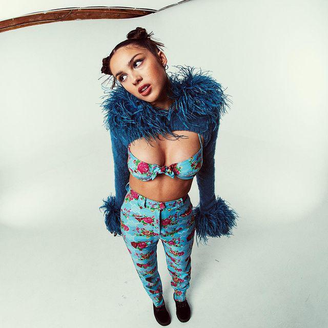 Olivia Rodrigo in a blue floral outfit