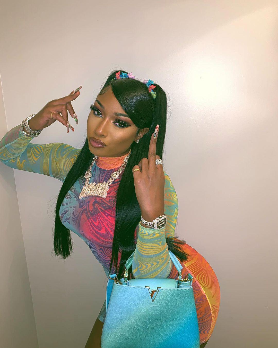Megan Thee Stallion in a colorful outfit
