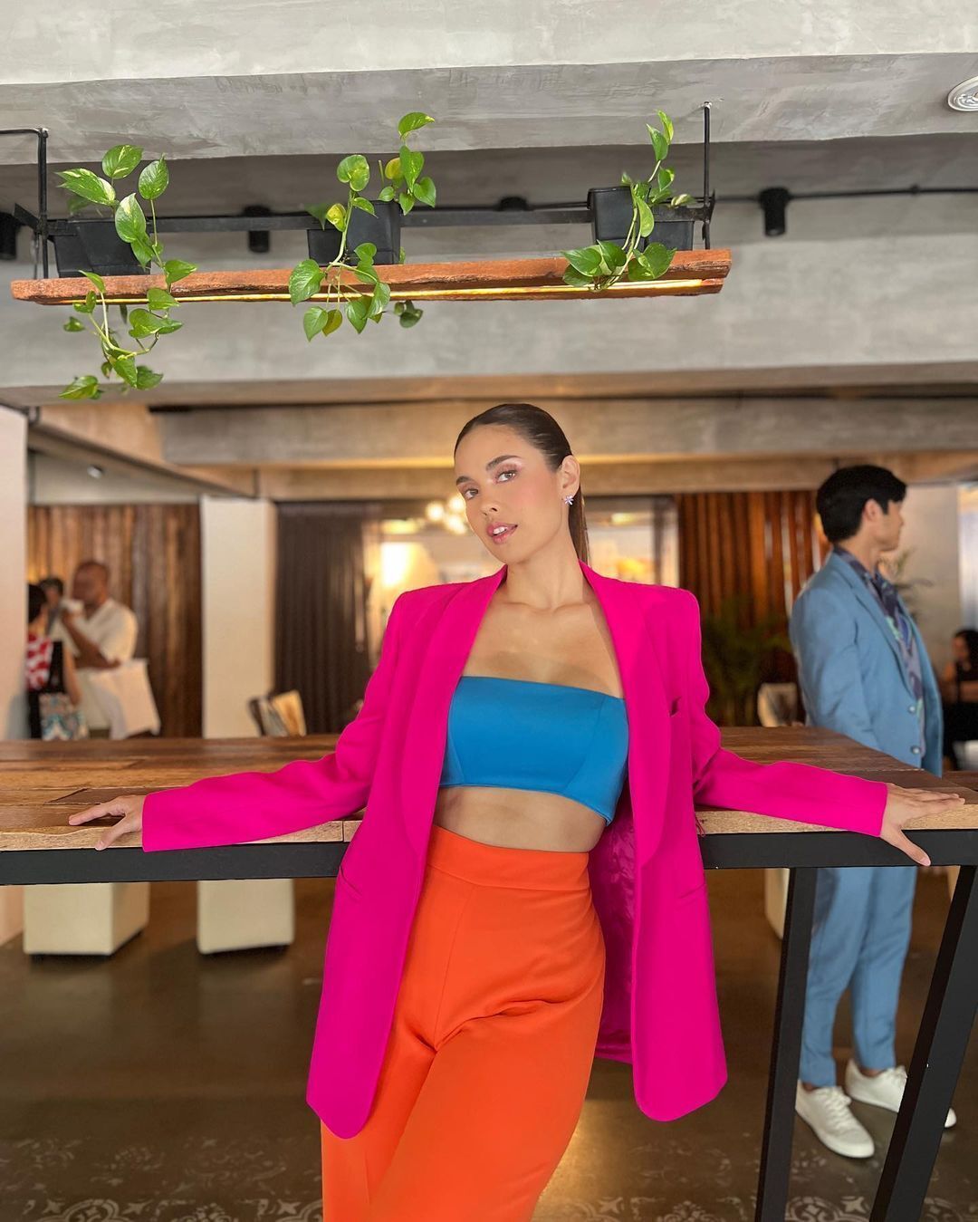 Beauty queen Megan Young wearing color-blocked orange, blue, and pink suit.