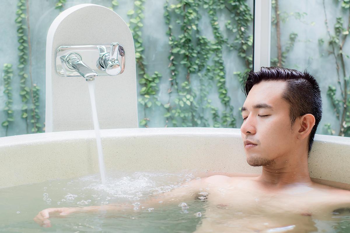 Asian man in a bath tub