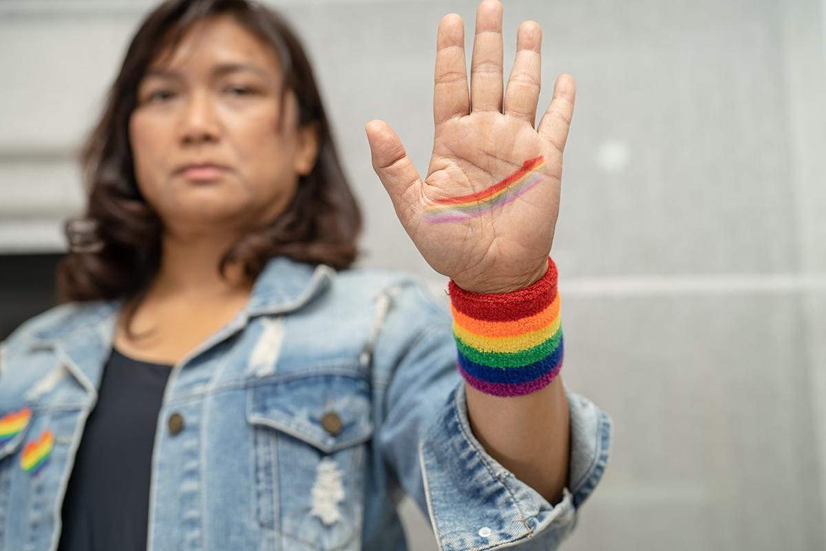 Asian woman wearing rainbow wristband