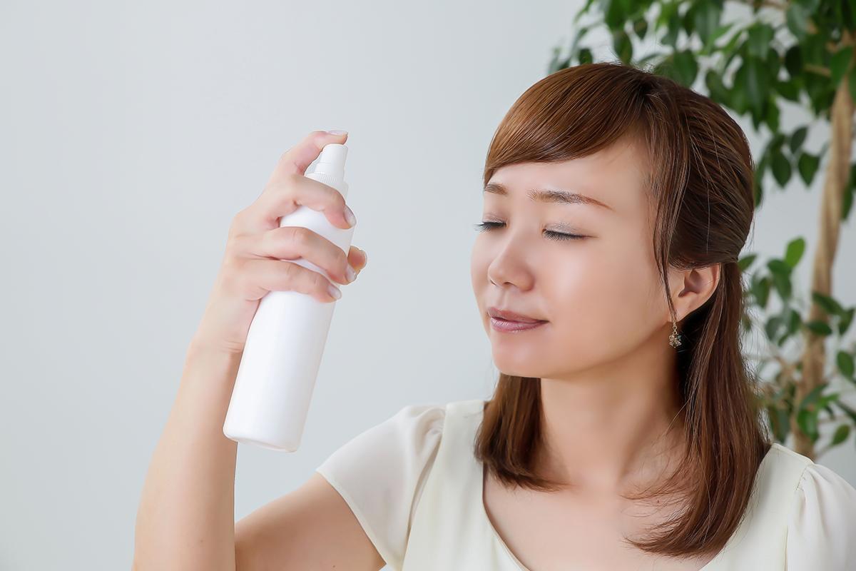 Asian woman using face mist