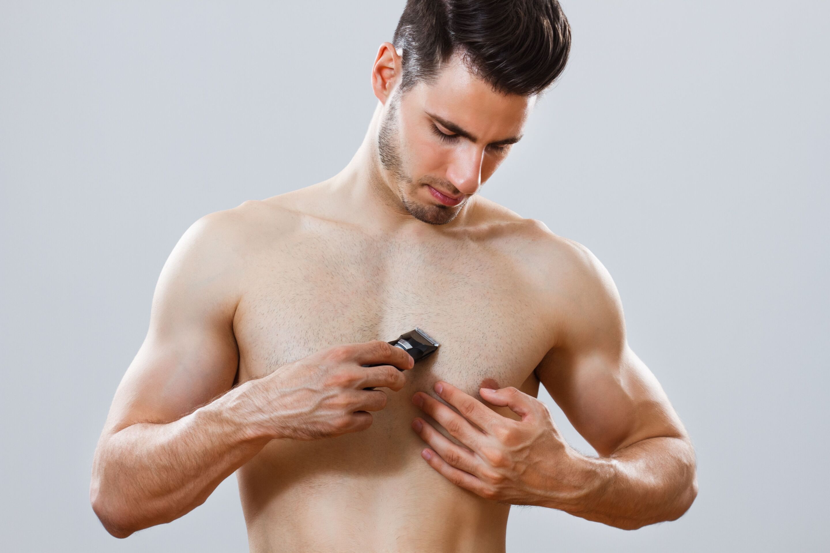 Man shaving chest hair
