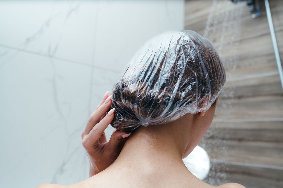 Woman in transparent shower cap.